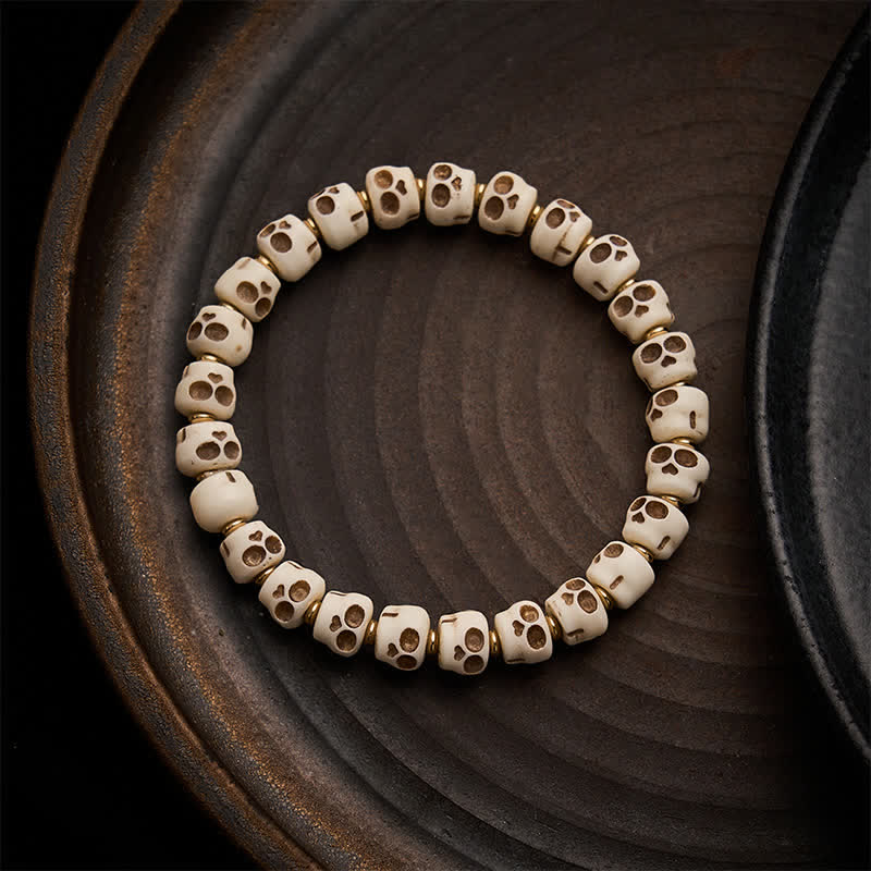 Buddha Stones Bracelet en perles d'os tibétaines, motif crâne du Seigneur de la Forêt des Cadavres, symbole de protection et de courage - 9 × 6,3 mm - image 0