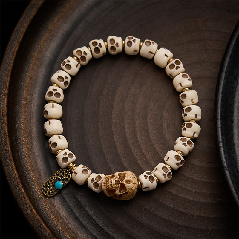 Buddha Stones Bracelet tibétain en perles d'os sculptées à la main, motif crâne du Seigneur de la Forêt des Cadavres, symbole de force et de changement - 9×6,3 mm - image 0