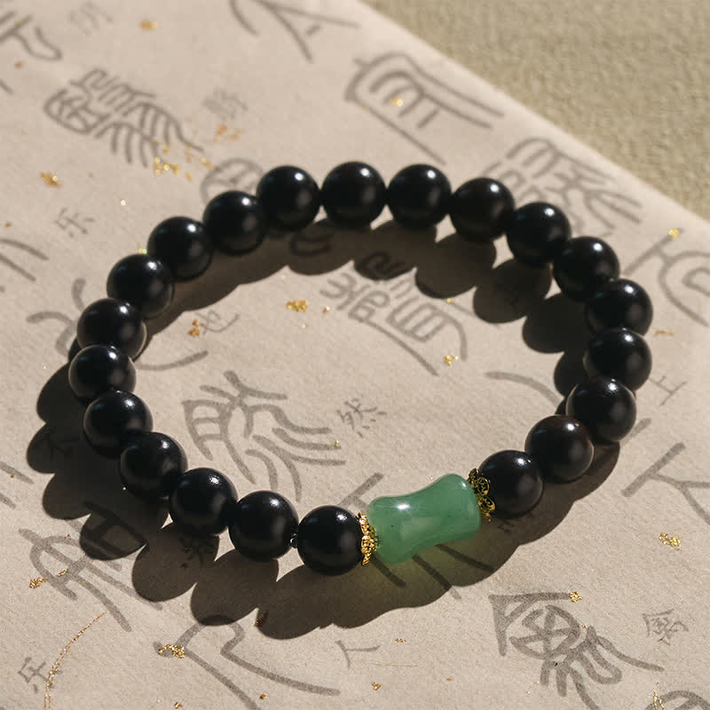 Buddha Stones Bracelet unisexe en bois d'ébène, bois de santal vert et grain naturel - image 1