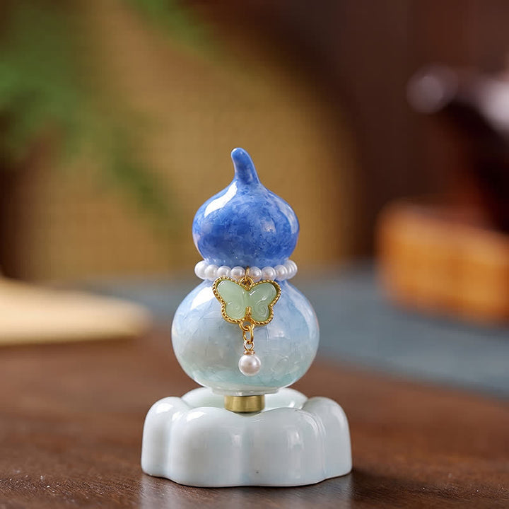 Buddha Stones Gourde papillon en céramique rotative, décoration pour une vie consciente - Gourde bleu foncé + papillon vert clair + base bleue - image 0