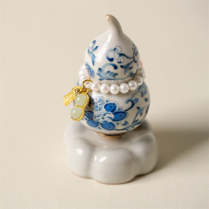 Buddha Stones Gourde rotative en céramique bleue et blanche en forme de lotus, décoration pour un mode de vie conscient - Base blanche, environ 4,8 cm × 4,8 cm × 8,5 cm - image 0