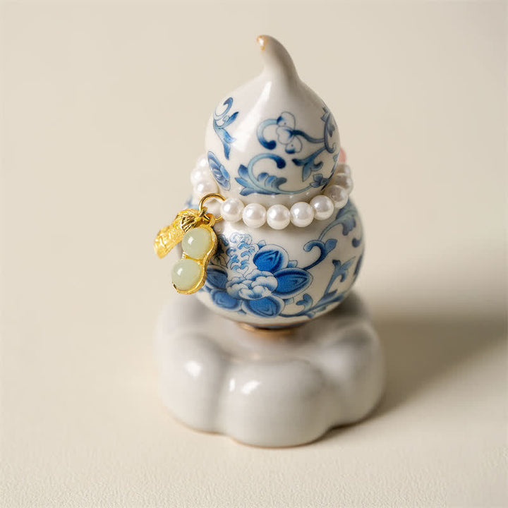 Buddha Stones Gourde rotative en céramique bleue et blanche en forme de lotus, décoration pour un mode de vie conscient - Base blanche, environ 4,8 cm × 4,8 cm × 8,5 cm - image 0