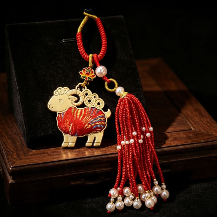 Buddha Stones Porte-clés pureté en brocart Song, lotus, chèvre, perle et pompon - image 1