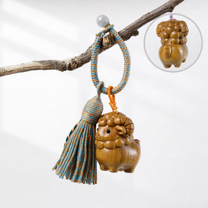 Buddha Stones Porte-clés à pompon en bois de santal vert sculpté à la main, motif chèvre arc-en-ciel et eucalyptus - Bois de santal vert - Orange Bleu - image 1