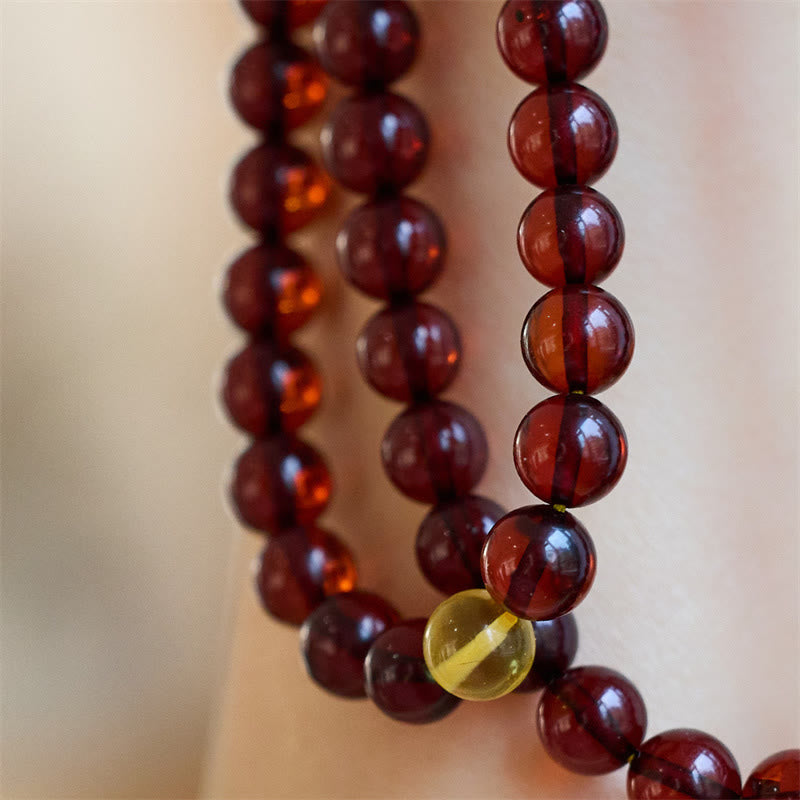 Bracelet Mala en Buddha Stones avec 108 perles d'ambre transparentes contre l'anxiété