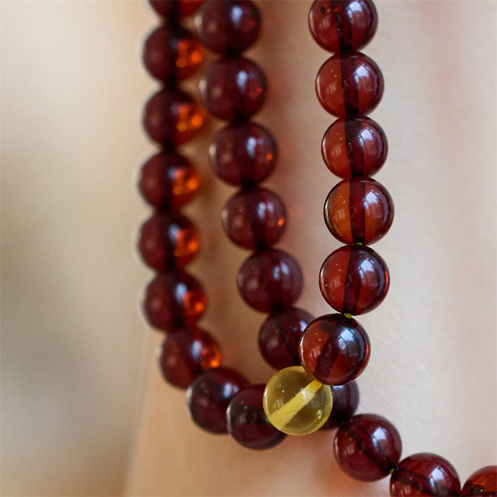 Bracelet Mala en Buddha Stones avec 108 perles d'ambre transparentes contre l'anxiété