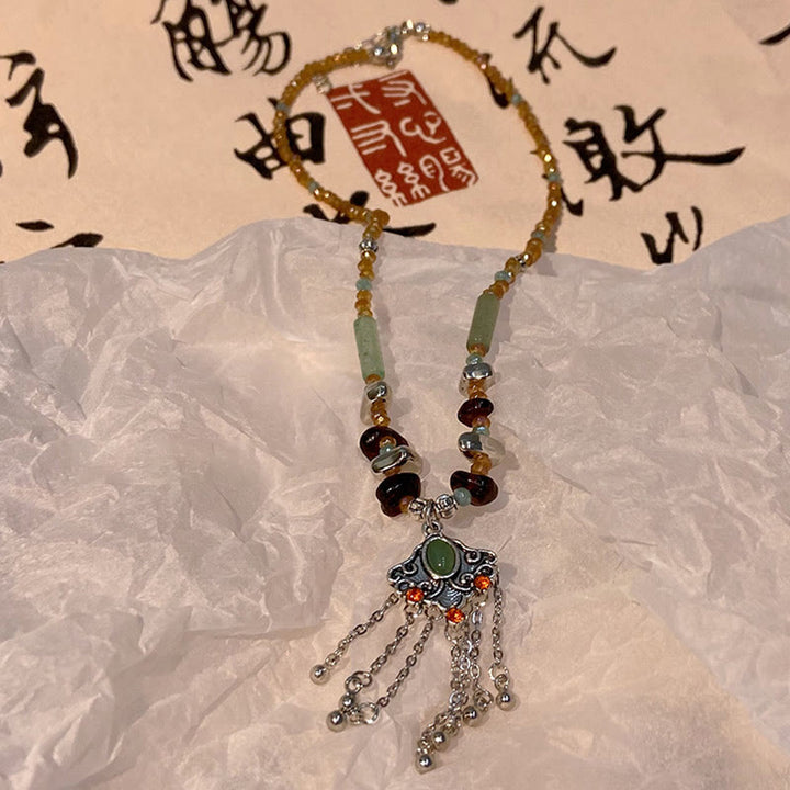 Collier pendentif pompon porte-bonheur en cuivre avec pierres de cristal tibétaines de Buddha Stones