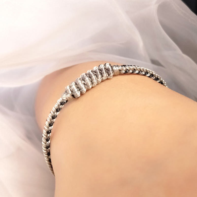 Bracelet de protection tressé à huit fils en Buddha Stones tibétain fait à la main avec roue de prière et nœud de paix