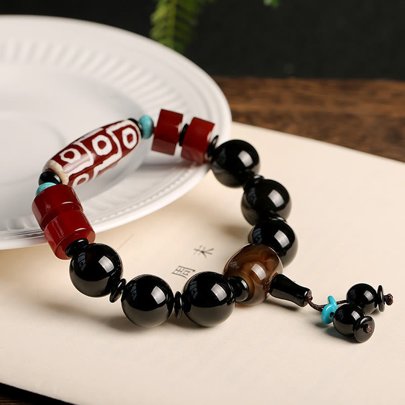 Bracelet tibétain de protection de richesse en onyx noir avec perles dzi à neuf yeux