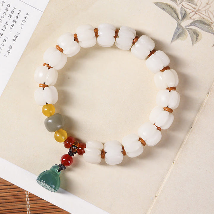 Bracelet en perles de citrouille gravées en agate rouge Bodhi Calme Harmonie Bodhi Graines naturelles Lotus