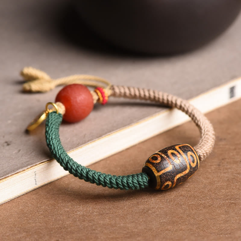 Bracelet en corde de richesse en perles tibétaines à neuf yeux Dzi fait main par Buddha Stones