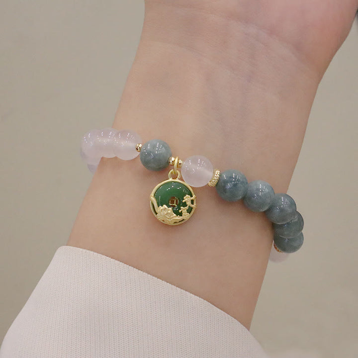 Bracelet de protection avec boucle de paix en Buddha Stones et jade blanc et fleur de lotus
