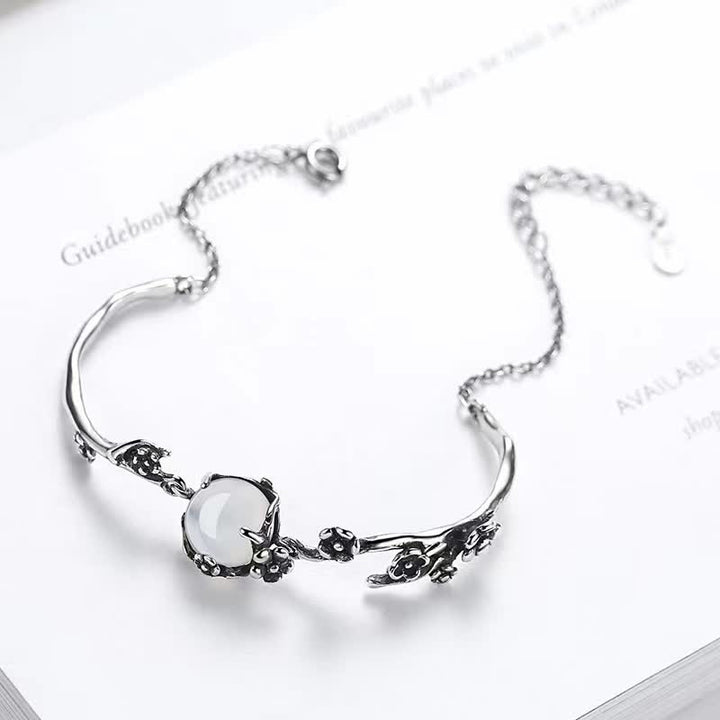 Bracelet positif en calcédoine et fleur de prunier avec Buddha Stones