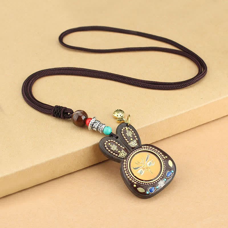Collier pendentif Thangka en ébène du Tibet représentant les cinq dieux de la richesse