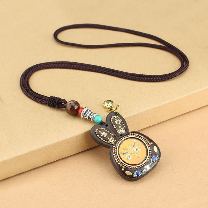Collier pendentif Thangka en ébène du Tibet représentant les cinq dieux de la richesse