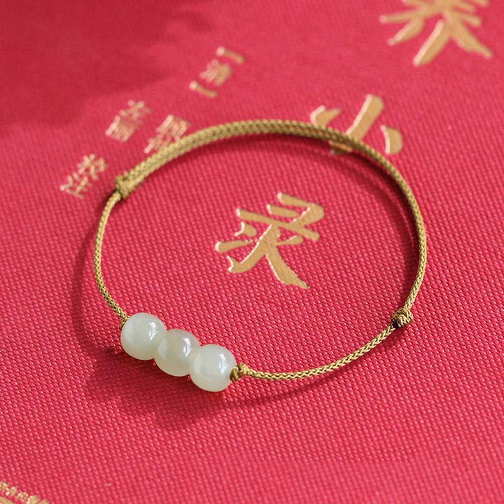 Bracelet tissé en fil de jade à trois perles de Buddha Stones
