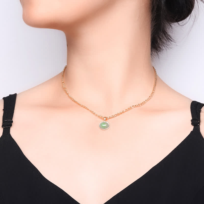 Collier pendentif ovale en acier titane et turquoise