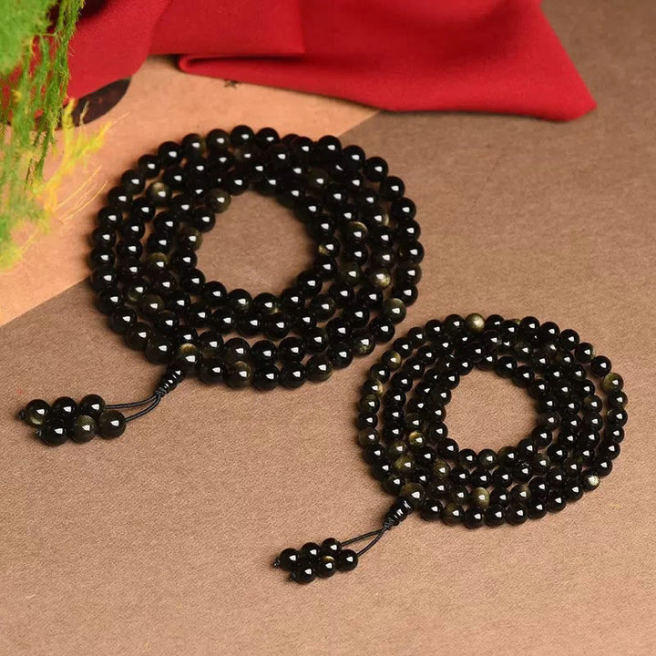 Bracelet de richesse en obsidienne naturelle dorée avec 108 perles de Mala Buddha Stones