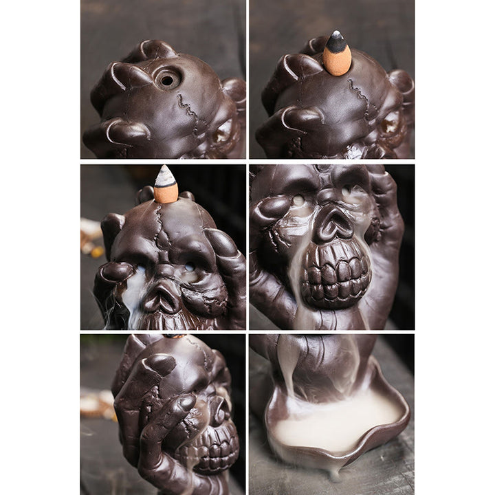 Brûleur d'encens spirituel en argile violette avec tête de mort et main fantôme en Buddha Stones
