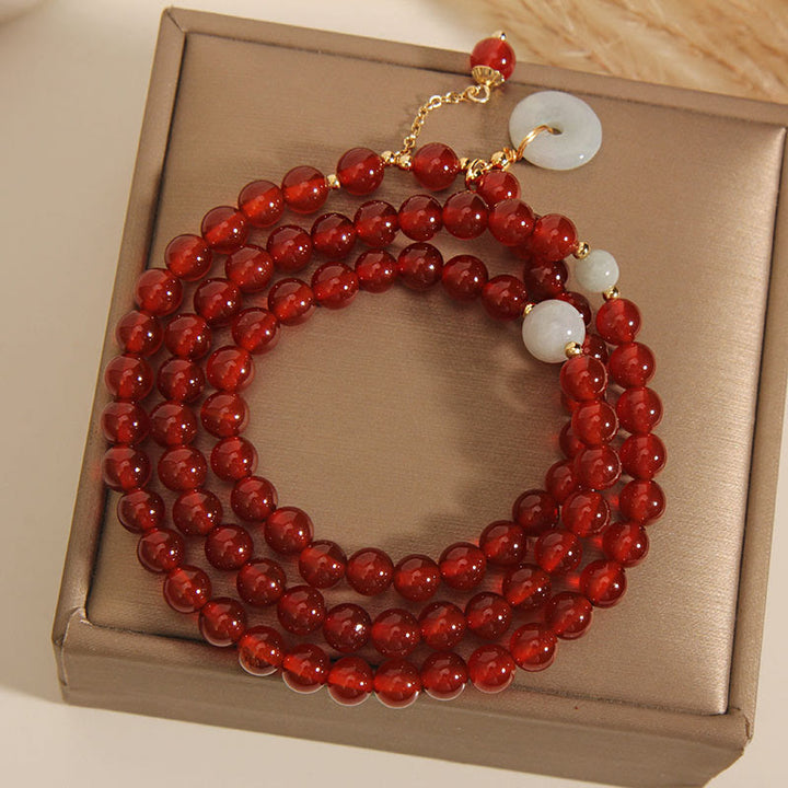 Bracelet triple tour en agate rouge naturelle et jade avec boucle de paix et calme en Buddha Stones