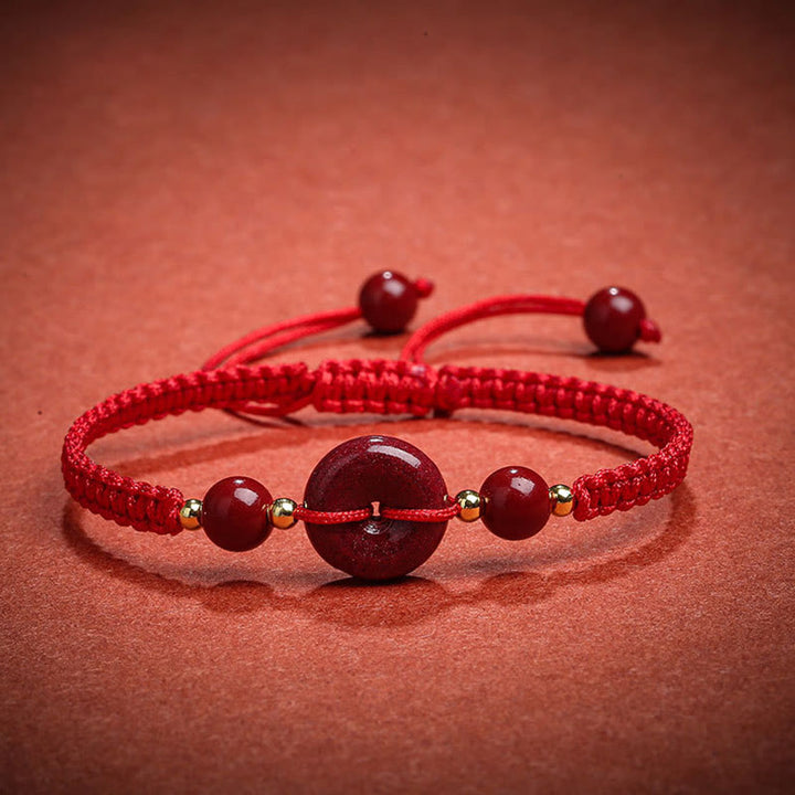 Bracelet de bénédiction en corde avec boucle de paix en cinabre naturel et Buddha Stones