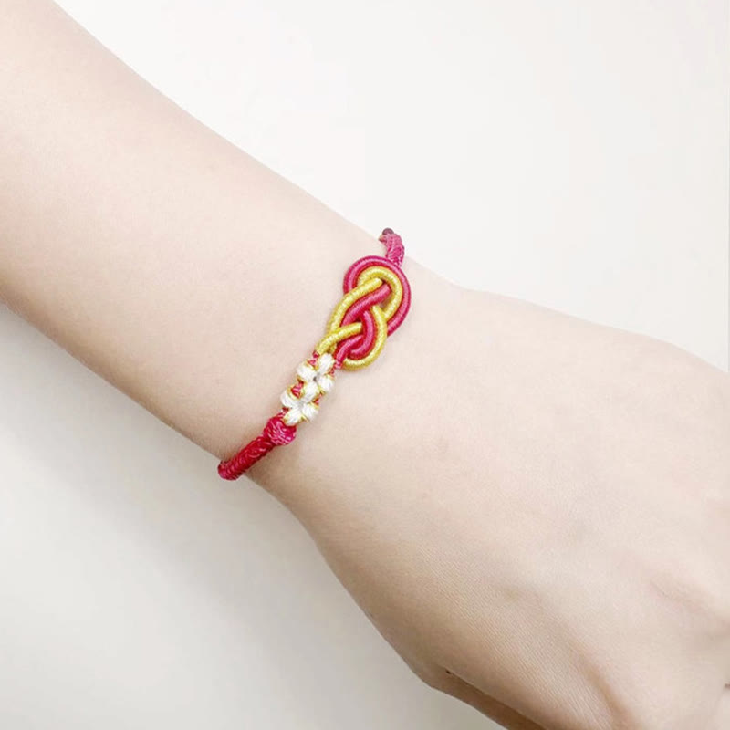 Bracelet de connexion porte-bonheur en forme de nœud de paix à huit fils fabriqué à la main par Buddha Stones