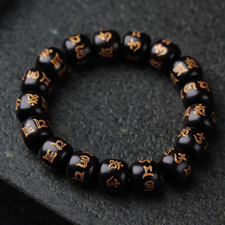 Bracelet de paix gravé en bois d'ébène tibétain avec Buddha Stones Om Mani Padme Hum