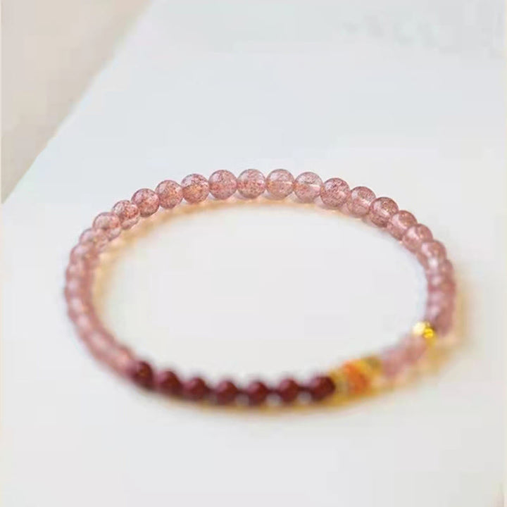 Bracelet de guérison porte-bonheur en quartz fraise et cinabre en Buddha Stones