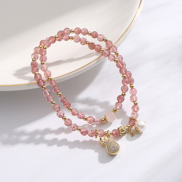 Bracelet double tour avec breloque positive et Buddha Stones en quartz fraise
