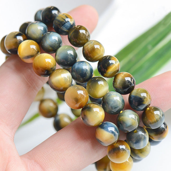 Bracelet de force, de courage et de protection en œil de tigre avec Buddha Stones
