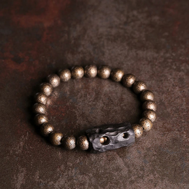 Bracelet de perles en bois d'ébène et cuivre avec Buddha Stones et équilibre