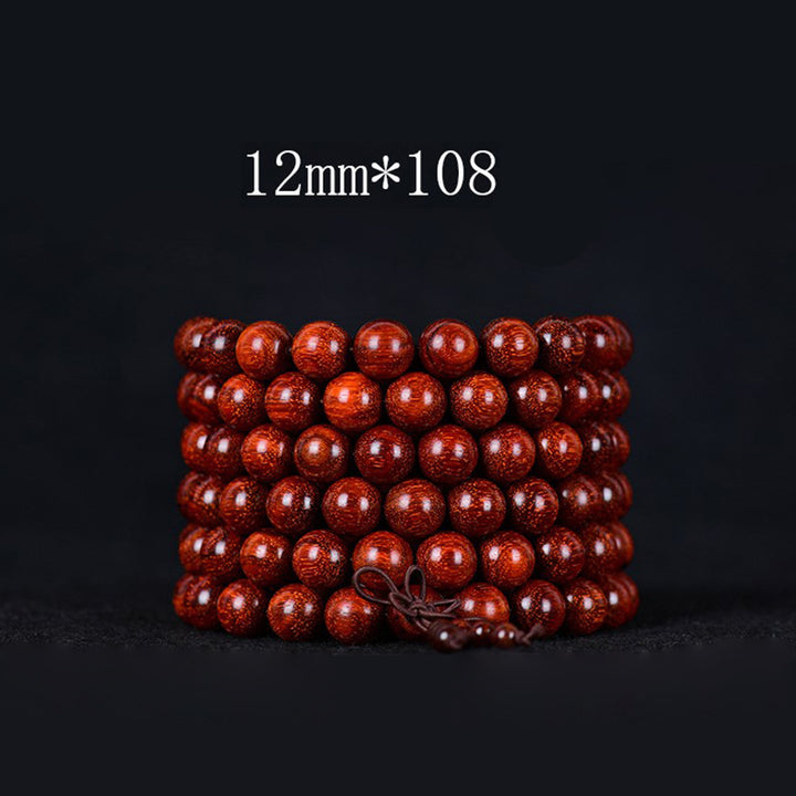 Bracelet d'équilibre tibétain en petites feuilles de santal rouge avec Buddha Stones