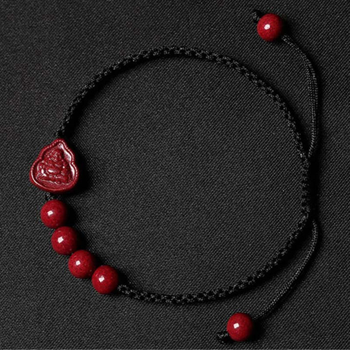 Bracelet en cordon de bénédiction en cinabre Bouddha rieur Avalokitesvara de Buddha Stones
