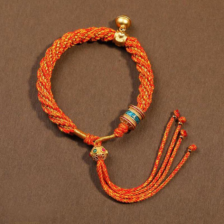 Bracelet tibétain fait main avec breloque en corde tressée et roue de prière Thangka pour protection de la chance