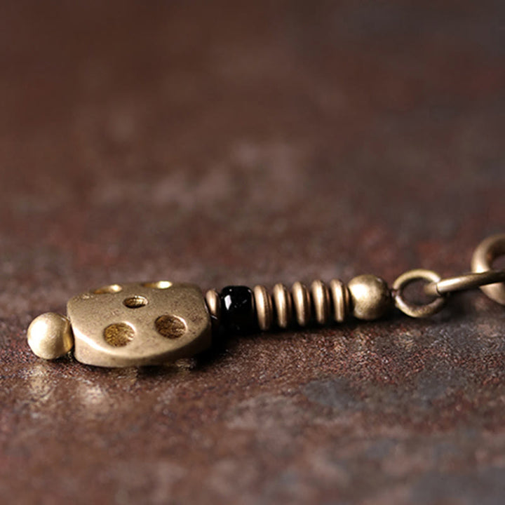 Bracelet multicouche positif en cuivre et bois d'ébène avec Buddha Stones arc-en-ciel obsidienne