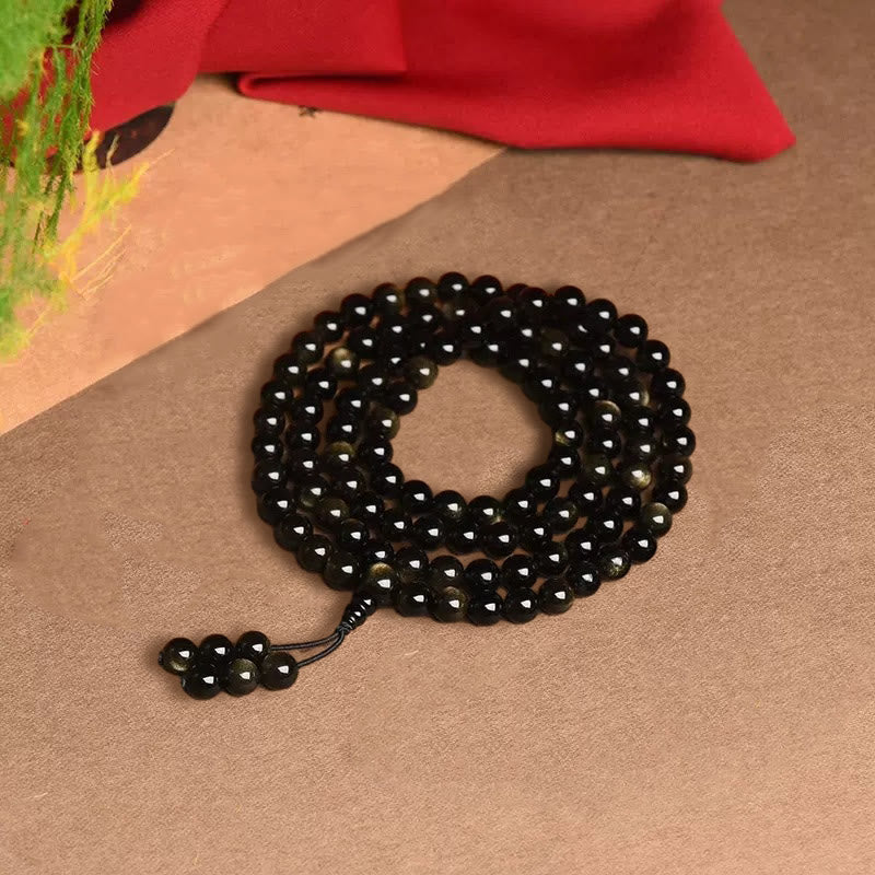Bracelet de richesse en obsidienne naturelle dorée avec 108 perles de Mala Buddha Stones