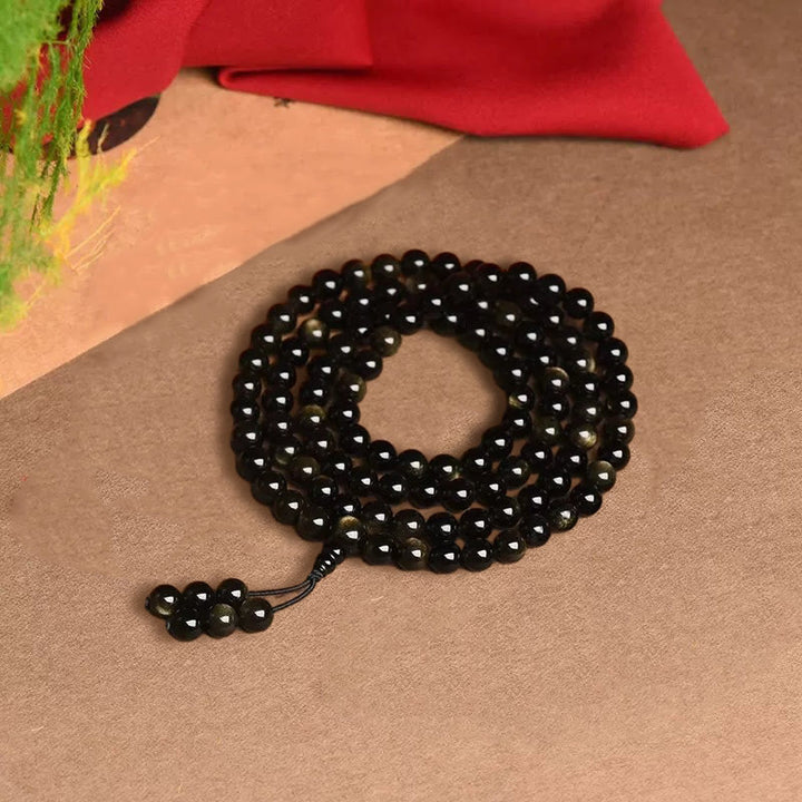 Bracelet de richesse en obsidienne naturelle dorée avec 108 perles de Mala Buddha Stones