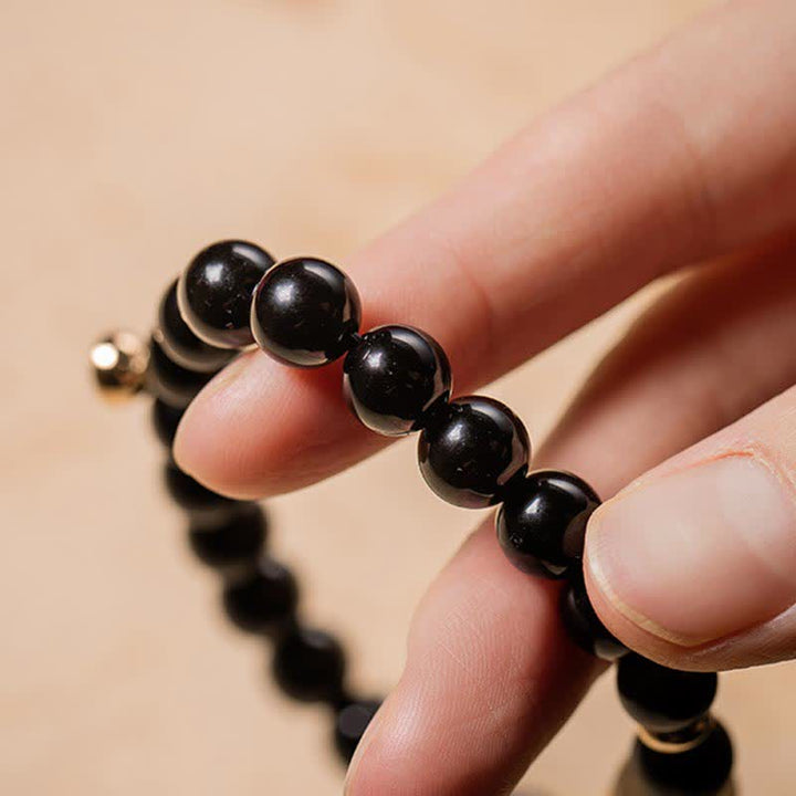 Bracelet magnétique pour couple en obsidienne Buddha Stones et jade Om Mani Padme Hum