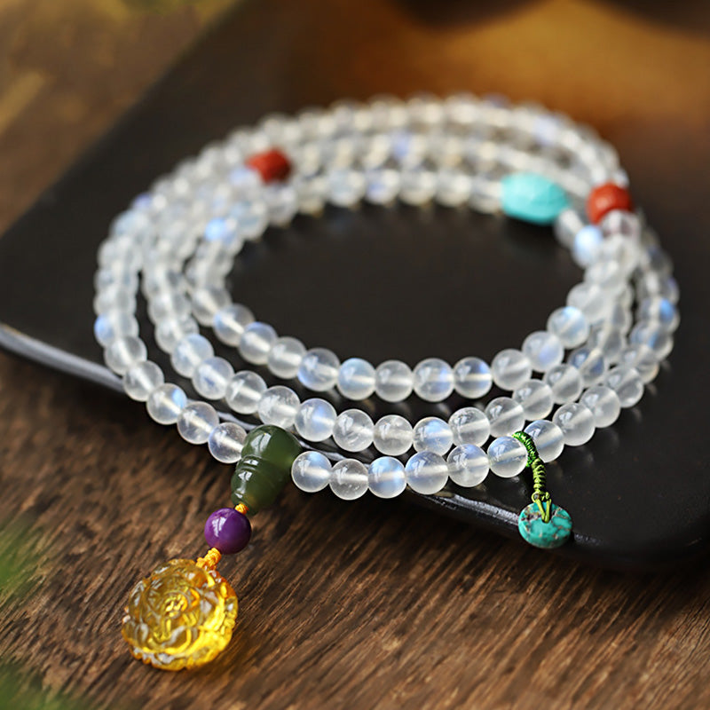 Bracelet de guérison en cristal de Buddha Stones : Mala, pierre de lune, ambre, lotus et turquoise. - Pierre de lune (Lueur variable – subtile à intense) - image 0