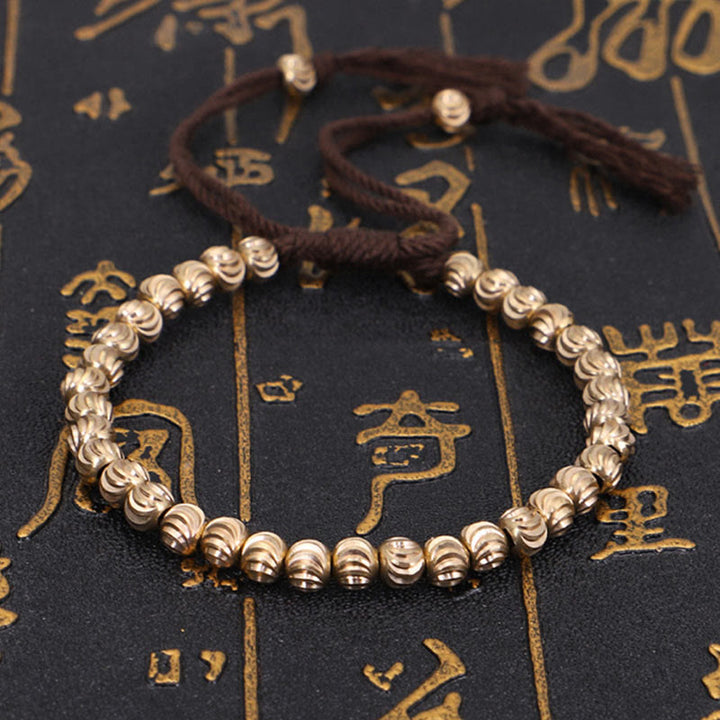 Bracelet porte-bonheur en perles de cuivre tibétaines faites à la main avec Buddha Stones
