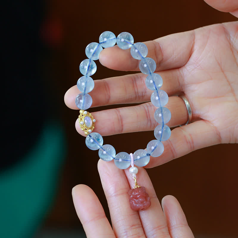 Bracelet de charme de guérison en perles d'agate rouge et aigue-marine naturelles de Buddha Stones - image 1