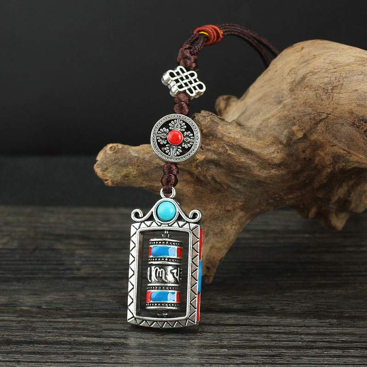 Porte-clés décoratif avec nœud rotatif et bénédiction en forme de roue de prière en six mots vrais en Buddha Stones