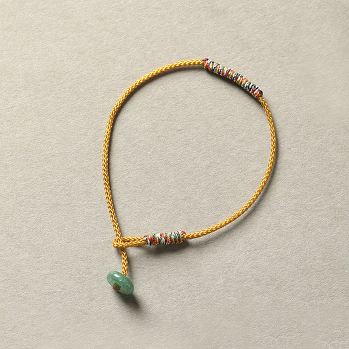 Bracelet en corde tressée tibétain fait main en aventurine verte avec Buddha Stones et protection de la chance