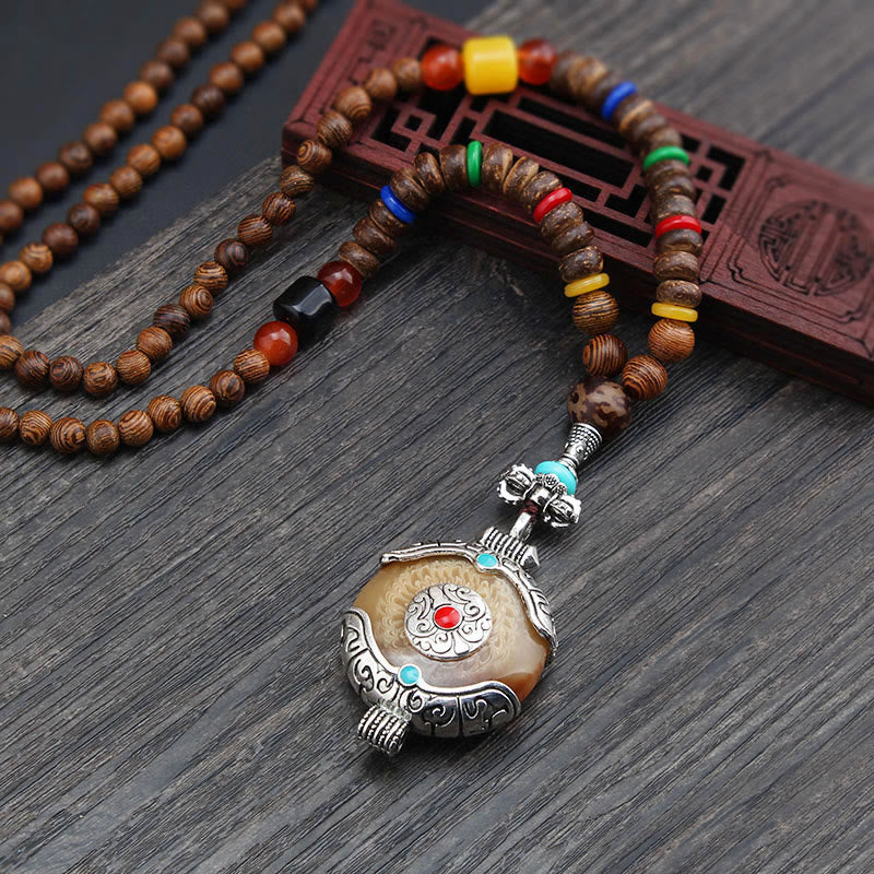 Collier pendentif protection éléphant en Buddha Stones tibétain en bois de wengé Bodhi Seed Agate