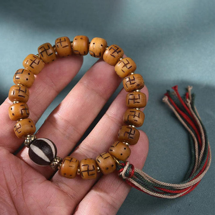 Buddha Stones en os de chameau tibétain naturel, croix gammée Dzi, perle Shankha, breloque de bouddha Kirtimukha, Bracelet à pompon de Protection porte-bonheur