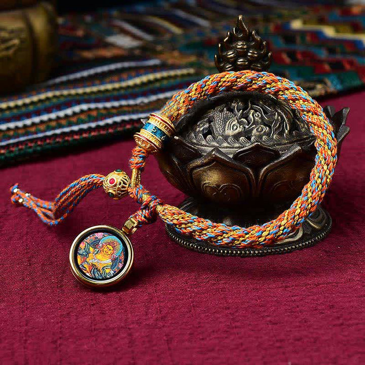 Bracelet tibétain en corde tressée avec breloque porte-bonheur Thangka en Buddha Stones