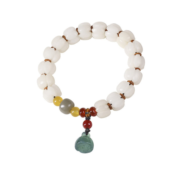 Bracelet en perles de citrouille gravées en agate rouge Bodhi Calme Harmonie Bodhi Graines naturelles Lotus