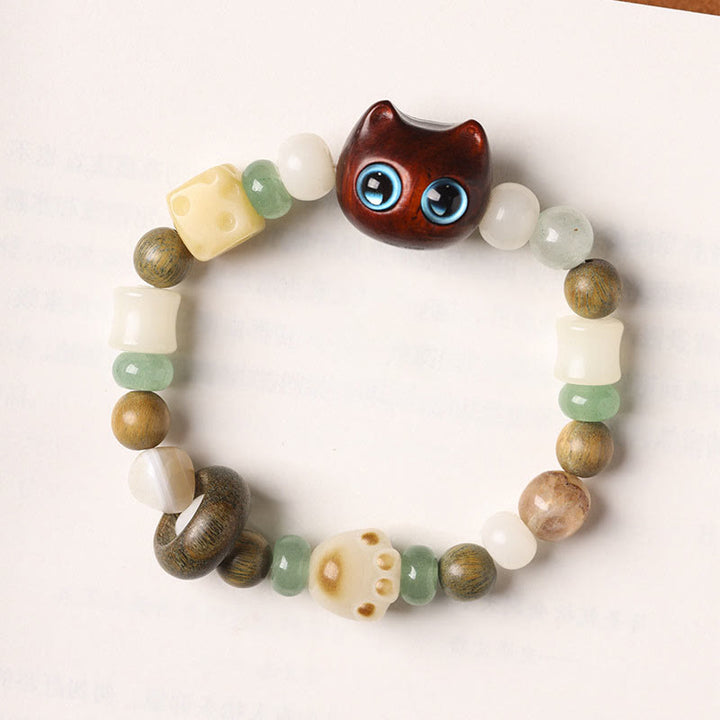 Buddha Stones Graine de Bodhi Bois de santal vert Bois d'ébène Petite feuille Bois de santal rouge Tête de chat Patte Griffe Bracelet de paix - image 12