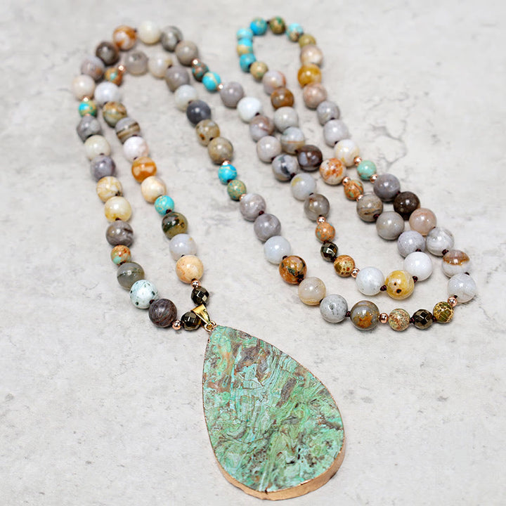 Collier de guérison en perles de jaspe Picasso naturel de l'océan Buddha Stones
