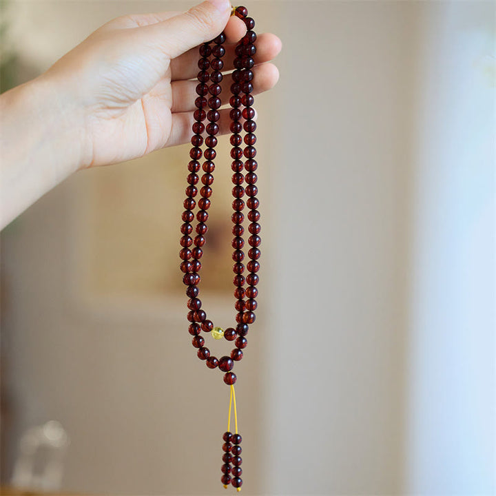 Bracelet Mala en Buddha Stones avec 108 perles d'ambre transparentes contre l'anxiété